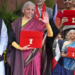 निर्मला सीतारमण Union Budget 2026 के साथ हाथ हिलाती हुईं