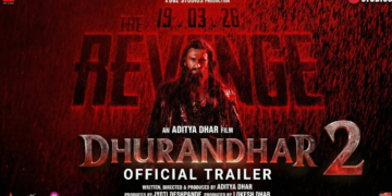 धुरंधर 2 का ऑफिशियल ट्रेलर पोस्टर – रणवीर सिंह हमजा के रूप में बारिश में भीगे हुए, रेड बैकग्राउंड के साथ "The Revenge" टाइटल। रिलीज डेट 19 मार्च 2026 | Dhurandhar 2 Teaser