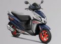 Honda Dio 125 X-Edition 2026 फ्रंट व्यू - बोल्ड ब्लू और ऑरेंज अलॉय व्हील्स वाला स्टाइलिश स्कूटर