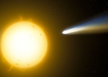 सूरज के पास sungrazing Comet C/2026 A1 (MAPS) की कल्पित इमेज, लंबी नीली-पीली पूंछ और सूरज की सतह पर प्रभाव दिख रहा है।